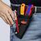'Tool holster on belt with KNIPEX folding knife, utility knife and pen, worn by a person in jeans and dark top.'