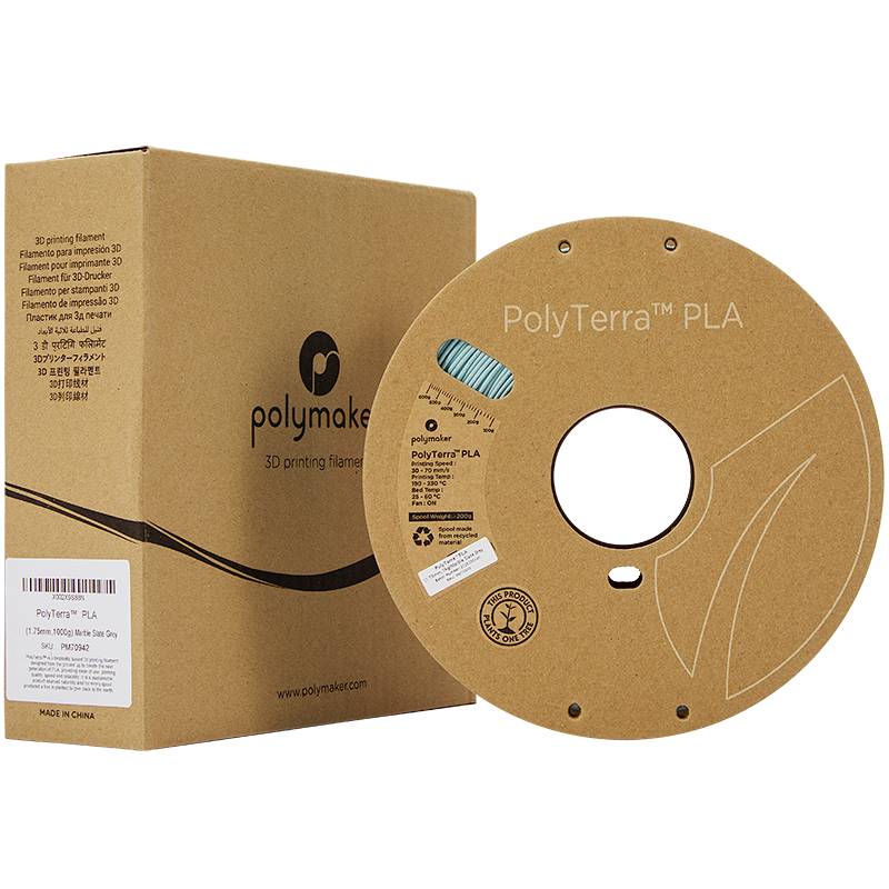 Een bruine spoel met het opschrift 'PolyTerra™ PLA' naast een bijpassende kartonnen doos, gebruikt als filament voor 3D-printers.