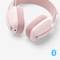 Draadloze, roze Bluetooth-koptelefoon met zachte oorkussens en bedieningsknoppen aan de zijkant.