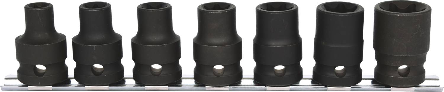 Een set van zeven zwarte steeksleutels in verschillende maten, naast elkaar gerangschikt op een metalen houder.