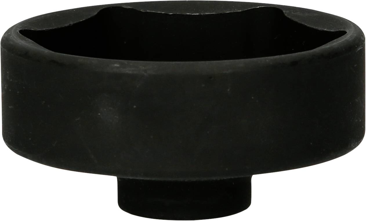 Een zwart, rond object met een holle binnenruimte en een platte bodem, mogelijk een gereedschap of onderdeel.