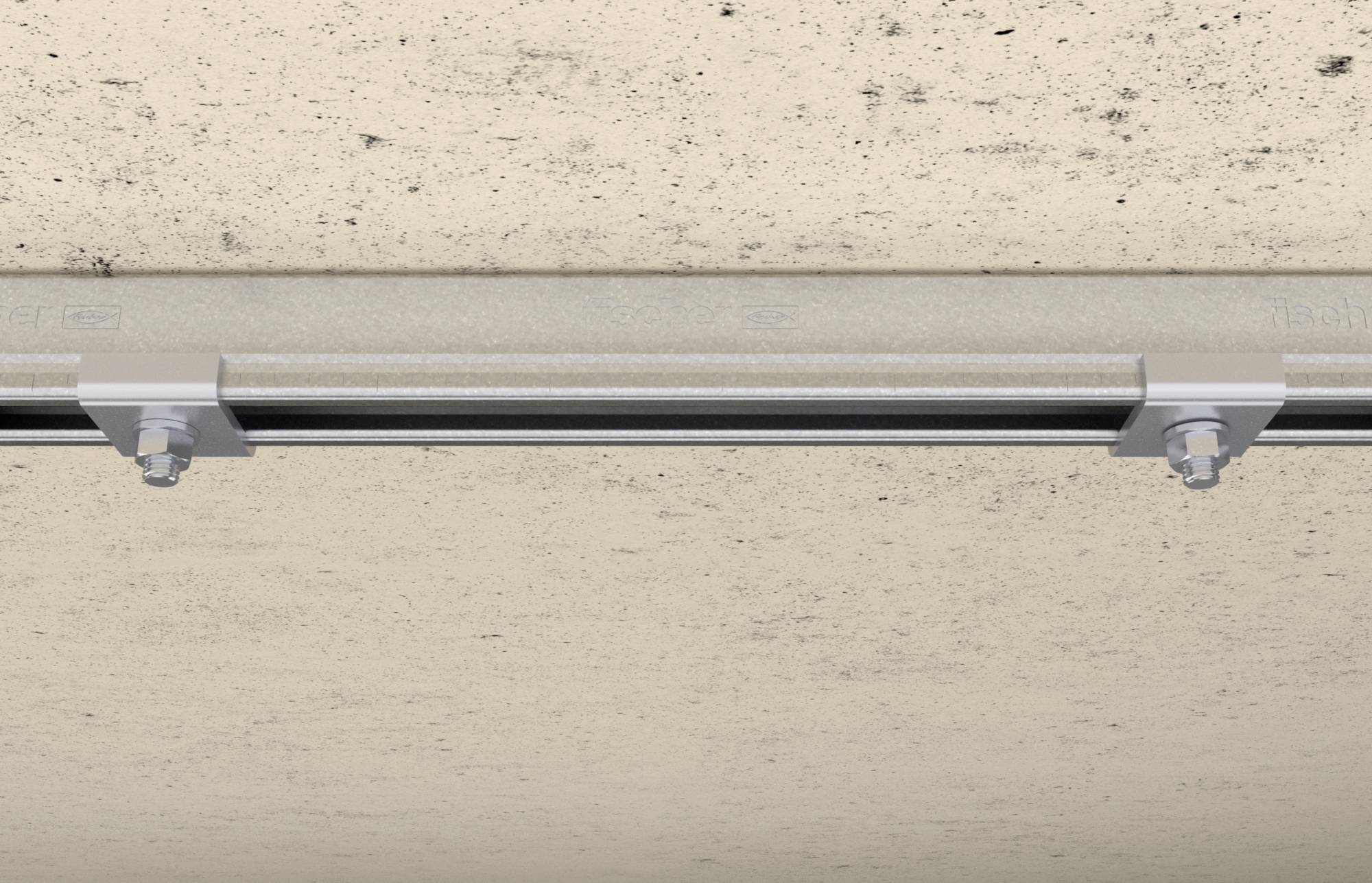 Metalen rail met schroeven bevestigd aan een betonoppervlak, dient voor de veilige montage van inbouwcomponenten aan wanden of plafonds.