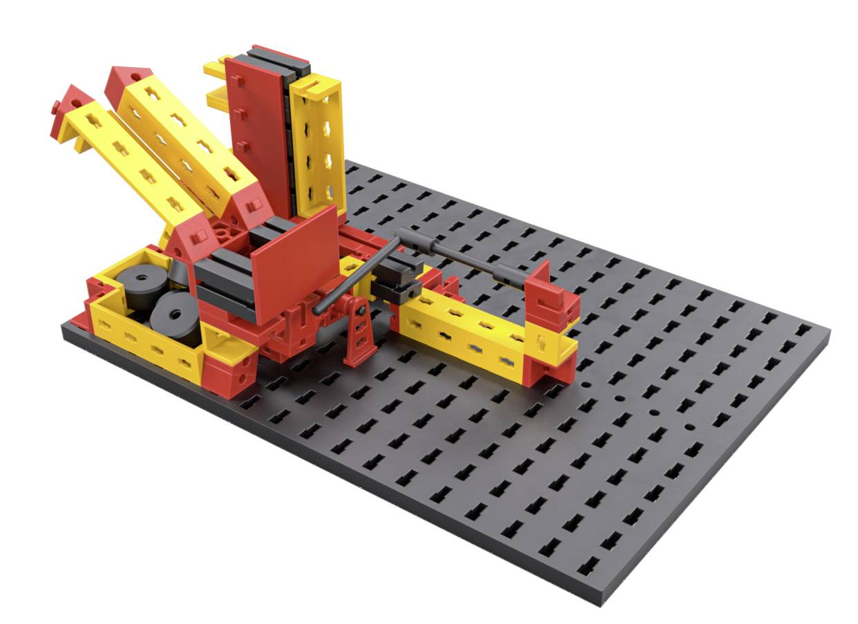 Speelgoedmodel van een mechanisch hijstoestel op een zwarte perforatieplaat, voornamelijk in geel en rood.