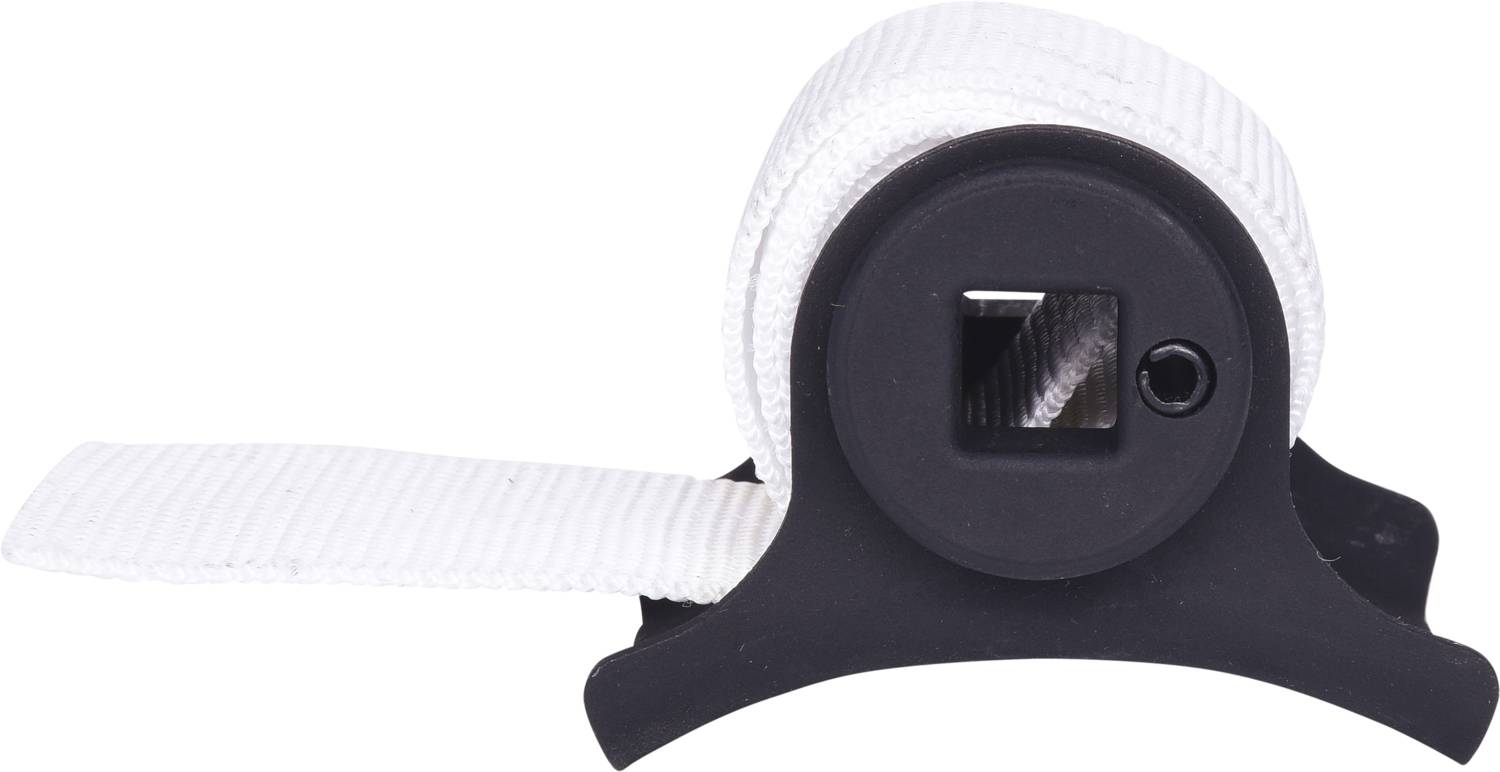 Een wit, opgerold lint in een zwarte houder. Het lint is gedeeltelijk afgerold en zichtbaar door een vierkaat gat.