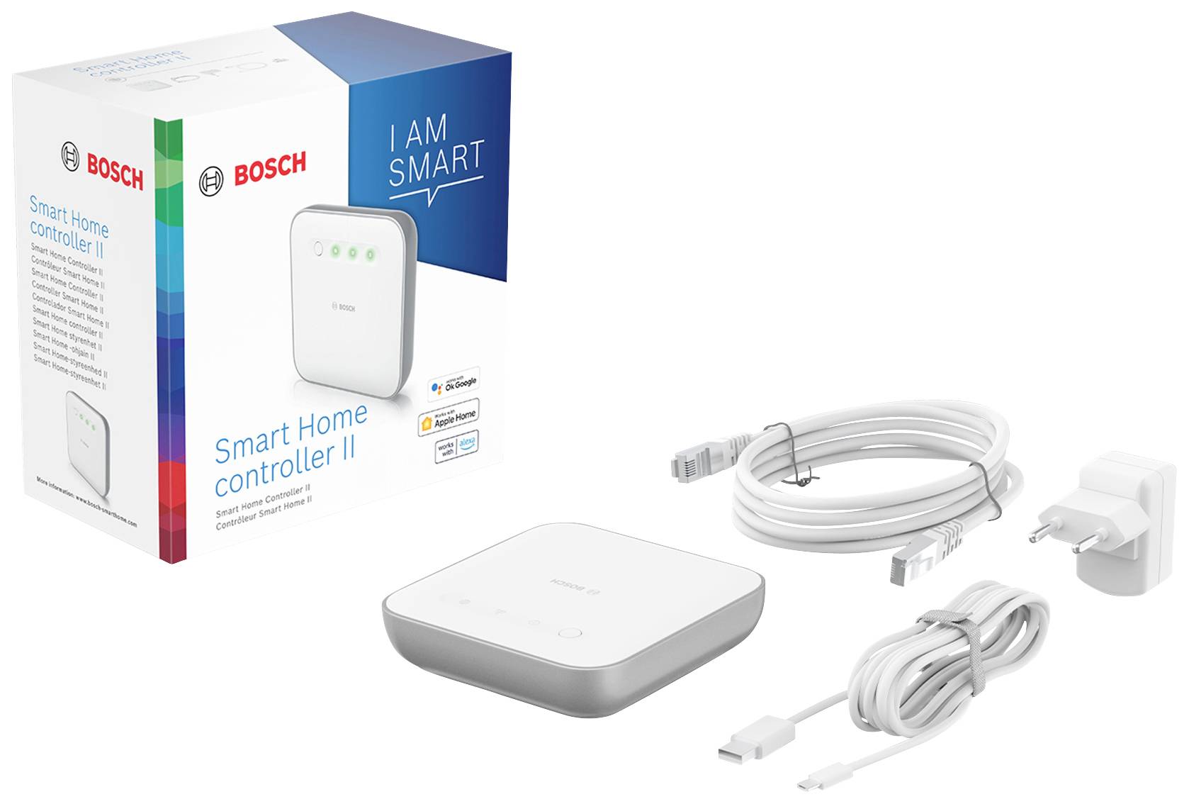 BOSCH Smart Home Controller II met verpakking, voedingsadapter, USB- en Ethernet-kabel. Opschrift op verpakking: 'I AM SMART'.