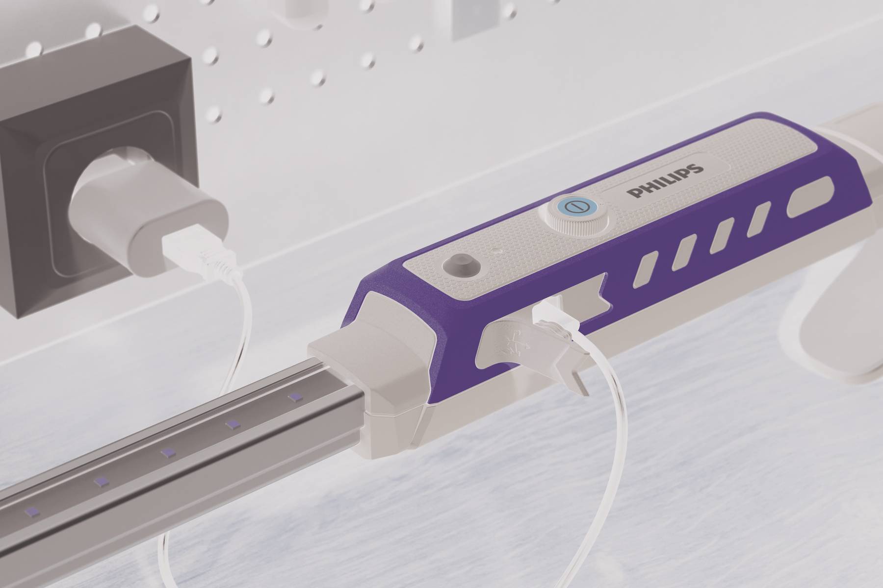 Laadstation met Philips-branding en meerdere USB-poorten, aangesloten op een stopcontact. Strak design in wit en blauw.