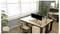 Een modern kantoor met twee bureaus, elk uitgerust met een computermonitor, stoelen en planten. Grote ramen zorgen voor veel natuurlijk licht.