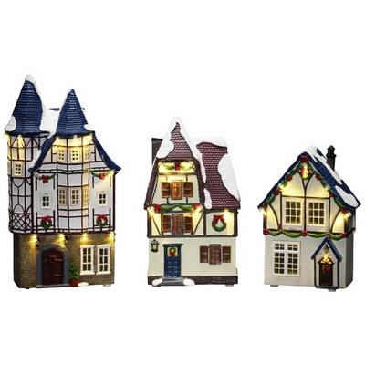 Drie decoratieve miniatuur kersthuisjes, traditioneel vormgegeven, met verlichting en sneeuw op de daken.
