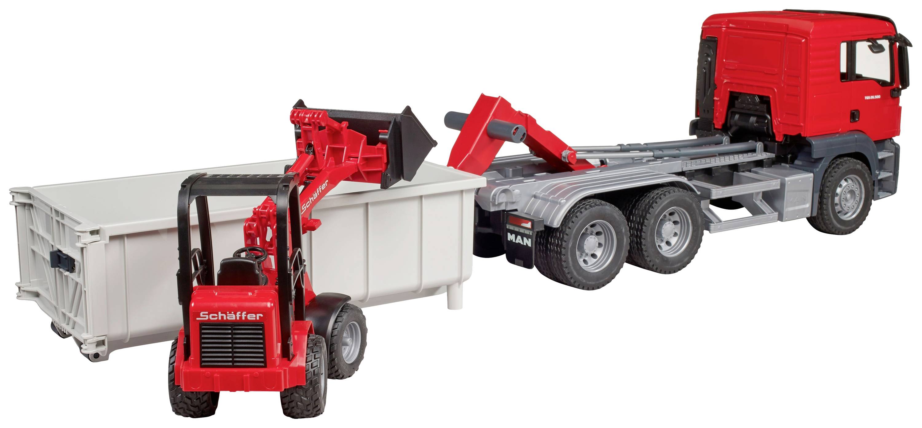 Een rode speelgoed-vrachtwagen trekt een witte container. Een rode speelgoedgraafmachine staat naast de container.