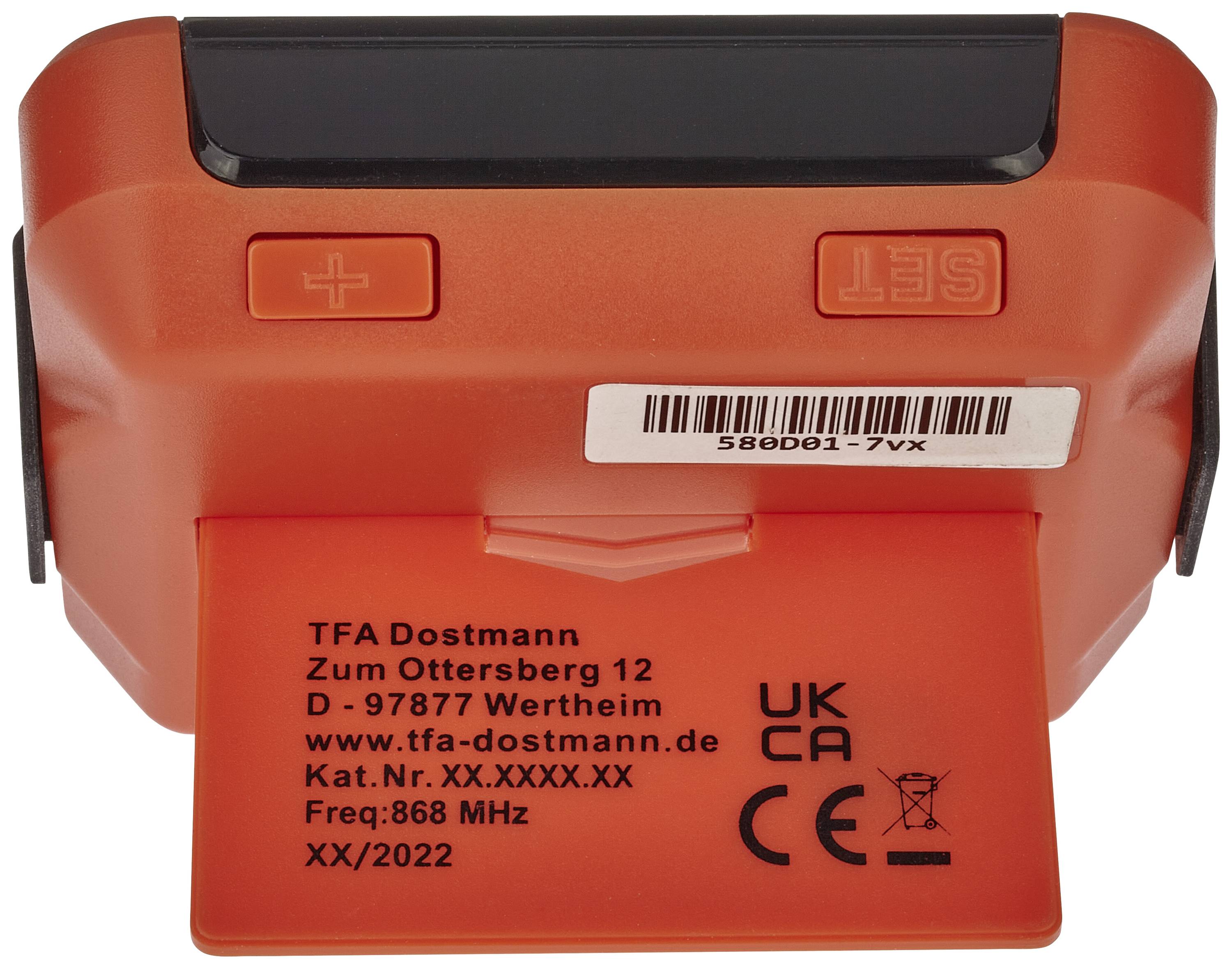 Een oranje apparaat met toetsen voor Plus, Min en 'SET', evenals een adres en frequentiegegevens op de achterkant.