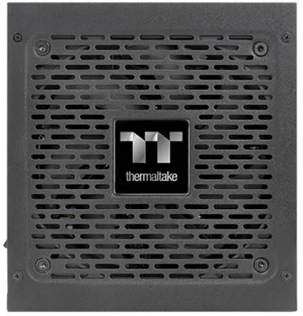 Zwart computervoedingsapparaat van Thermaltake met ventilatorrooster en logo in het midden.