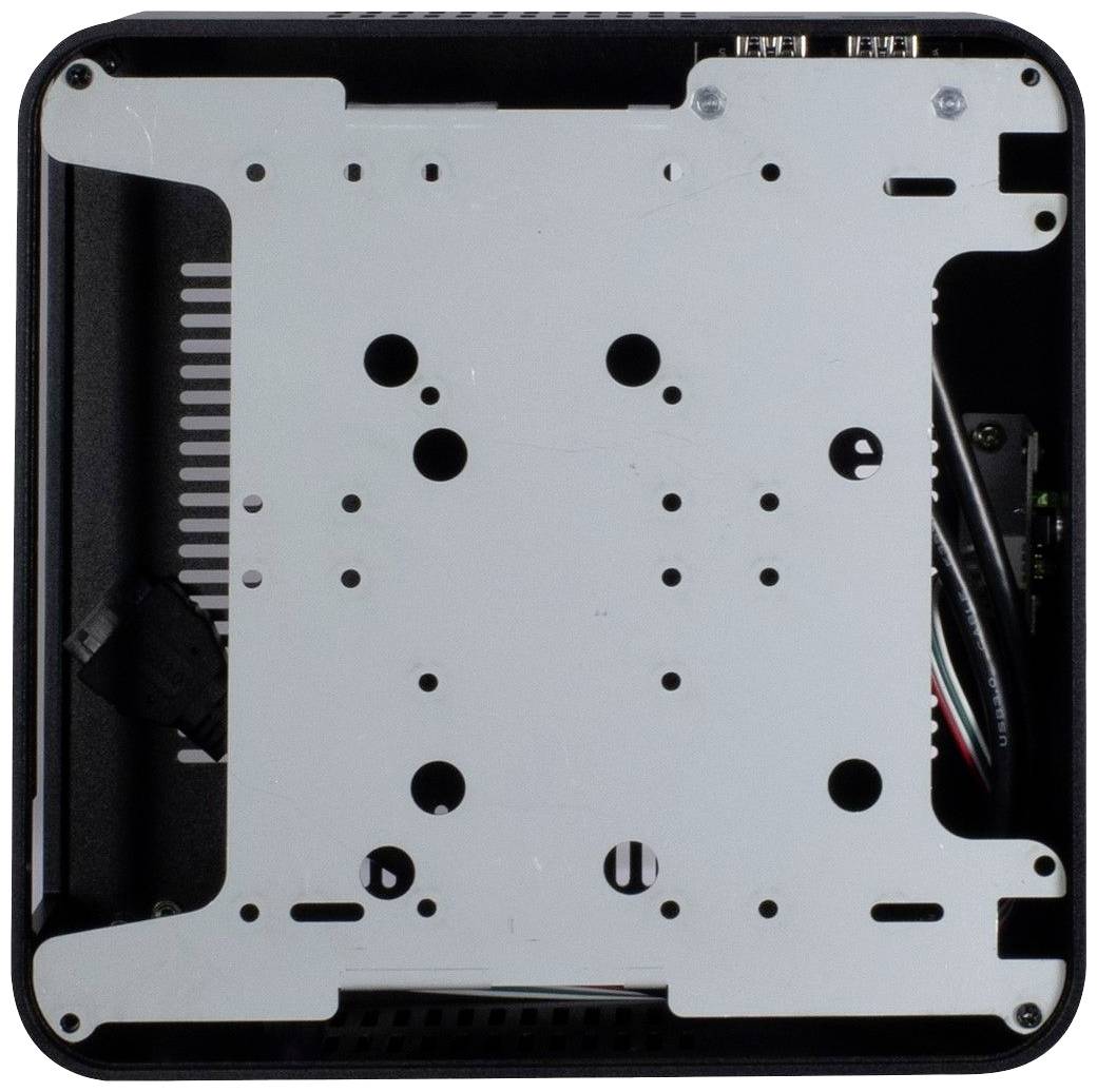 Een computerbehuizing gezien van bovenaf, toont een montageplaat met meerdere gaten voor hardware-bevestigingen. Kabels zijn zichtbaar.