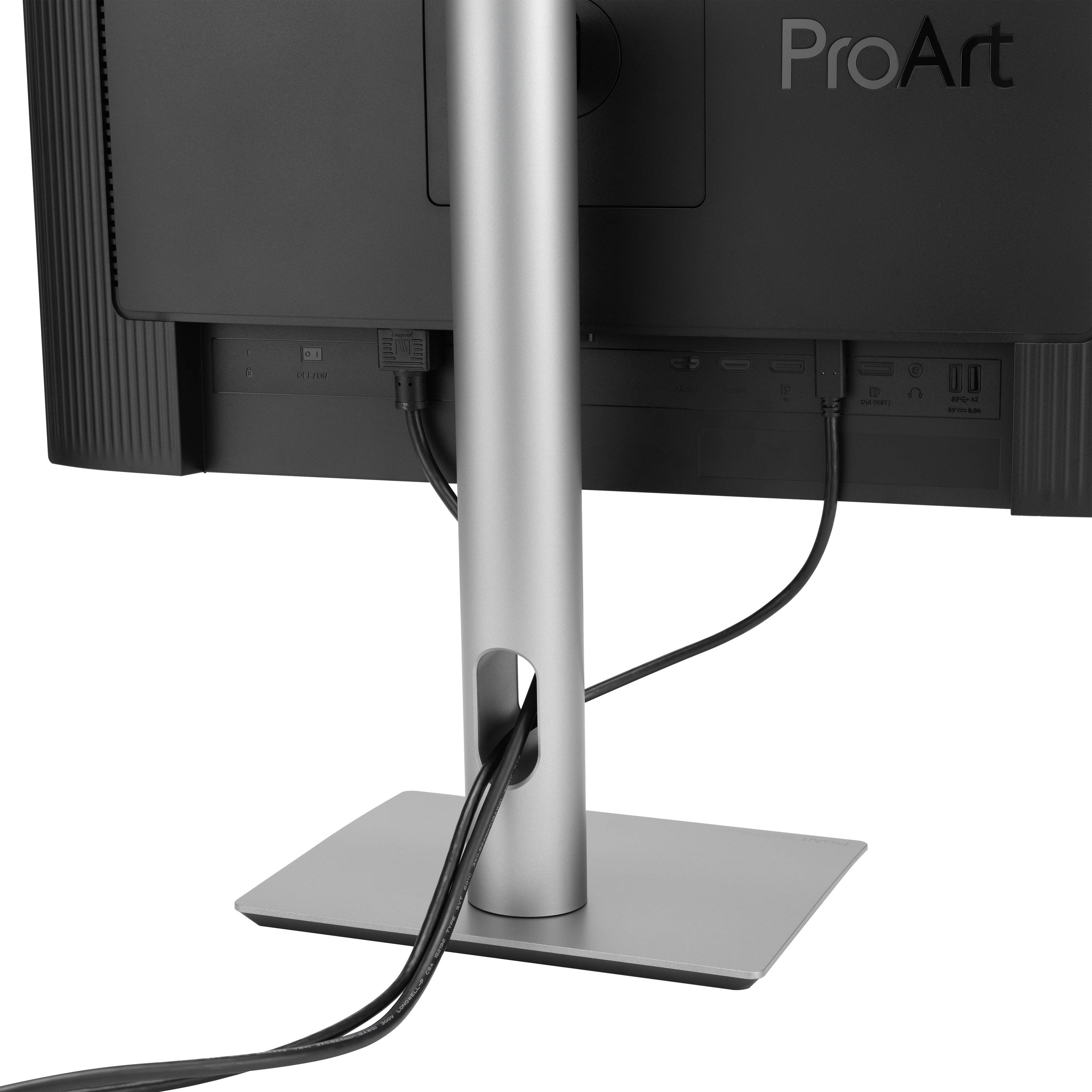 Achterkant van een monitor op een bureau. Het scherm is gemonteerd op een in hoogte verstelbare standaard. Kabels lopen langs de voet.