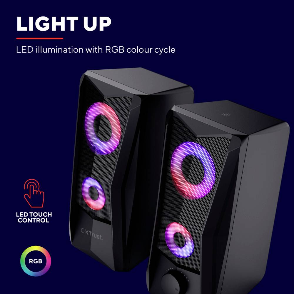 Twee zwarte luidsprekers met oplichtende, gekleurde LED-lichtringen. Tekst bovenaan beschrijft de RGB-verlichtingsfunctie en bediening.