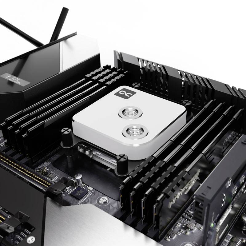 Een computermoederbord met een gemonteerde koelplaat op een processor. De koeleenheid is zilverkleurig met twee schroeven bovenop.