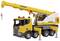 Een gele speelgoedkraan op een voertuig met meerdere wielen, gemarkeerd met het 'Liebherr' logo, bevindt zich op een witte achtergrond.