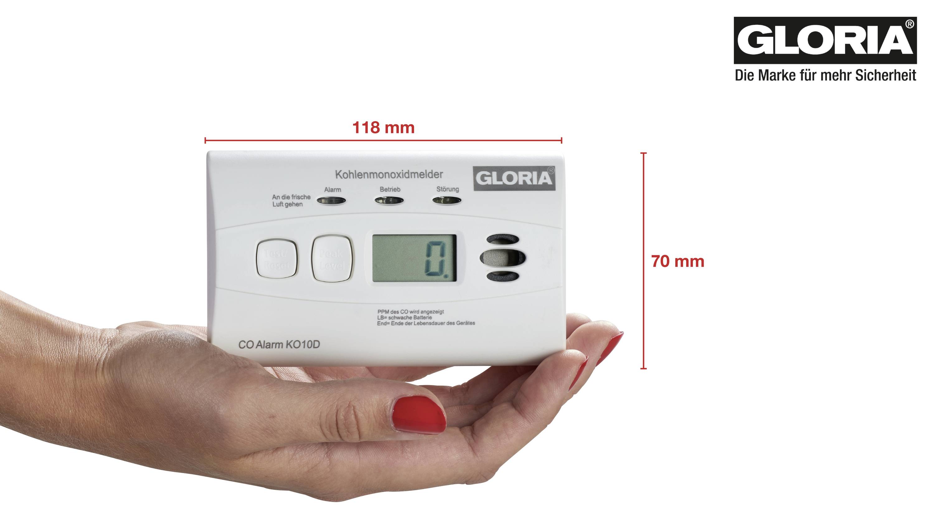 Hand houdt koolmonoxidmelder Gloria CO Alarm vast, toont waarde '0,1'. Apparaattype en afmetingen in millimeters aangegeven.