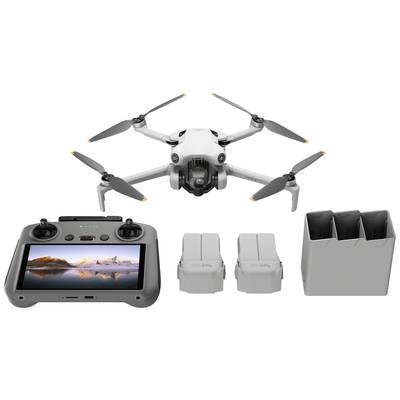 Een witte drone, twee accu's, een afstandsbediening met scherm en een oplader op een witte achtergrond.