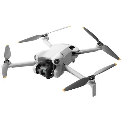 Witte drone met vier rotoren in de lucht, uitgerust met camera aan de voorkant.