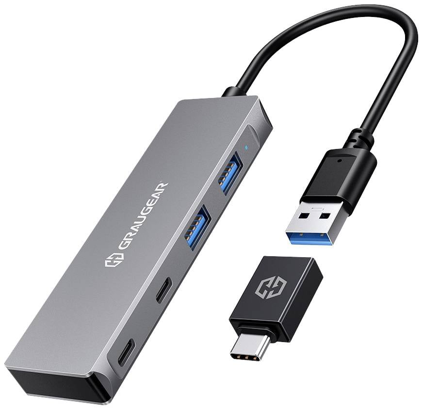 USB-hub met meerdere poorten, waaronder USB-A en USB-C. Zwarte kabel aangesloten op een zilveren, rechthoekige behuizing.