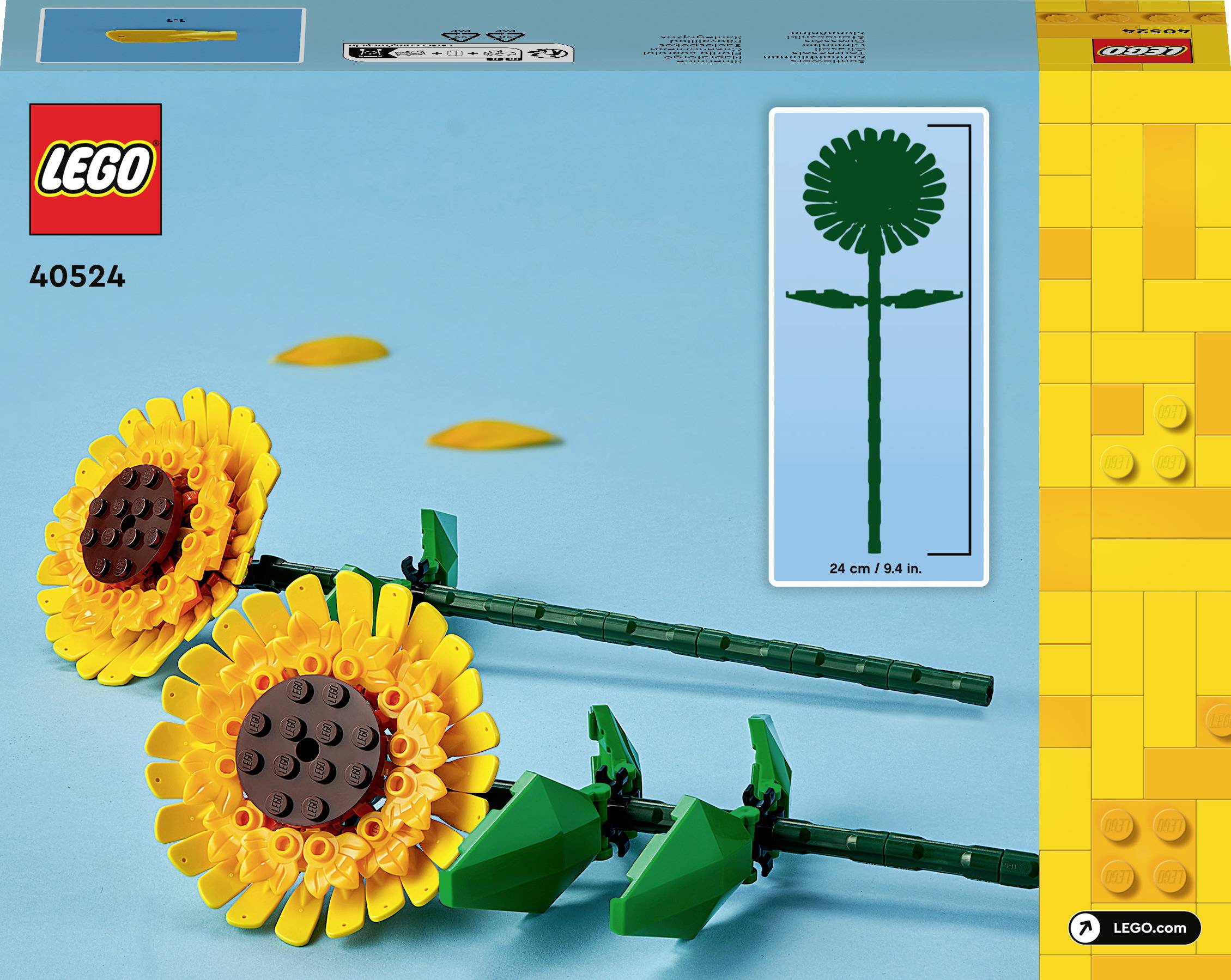 LEGO-set met zonnebloemen gemaakt van gele en bruine bouwstenen op een blauwe achtergrond. Verpakking toont modellengte: 24 cm.