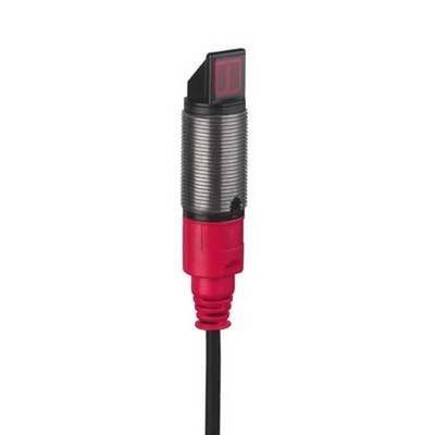 Een rode cilindrische sensor met zwarte kabel. Golvende metalen behuizing, rechthoekige zwarte en rode punt.