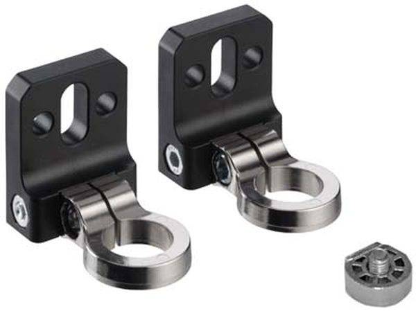 Twee zwarte metalen beugels met ovale openingen en zilveren scharnieren, naast een kleine ronde metalen schroef.