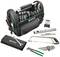 Een opengeslagen gereedschapstas met verschillende gereedschappen zoals schroevendraaiers, tangen en moersleutels, naast een metaalzaag en meetlint.