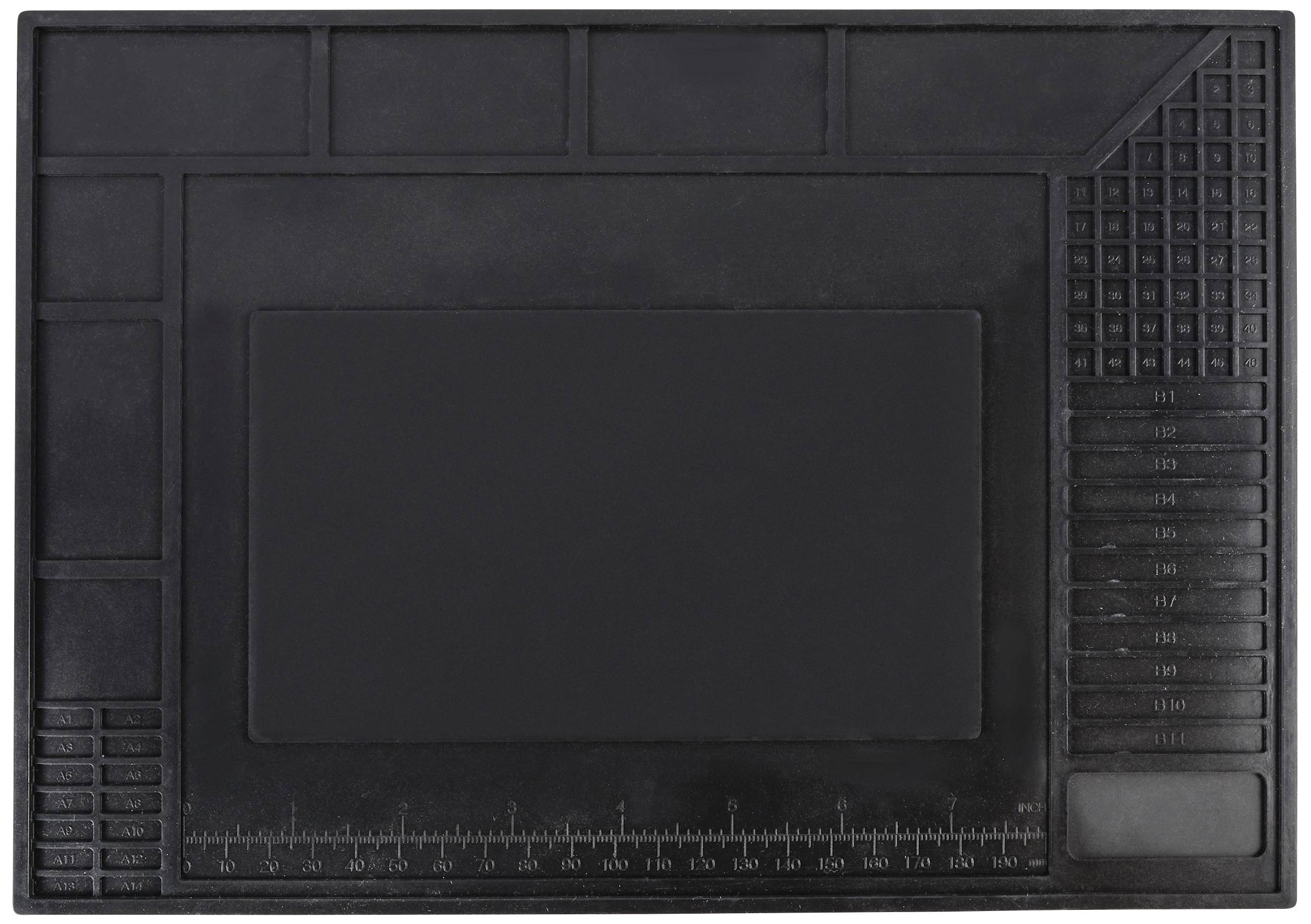Een zwarte antistatische werkmat met rechthoekige vakken en een liniaal aan de rand, gebruikt voor elektronische reparaties.