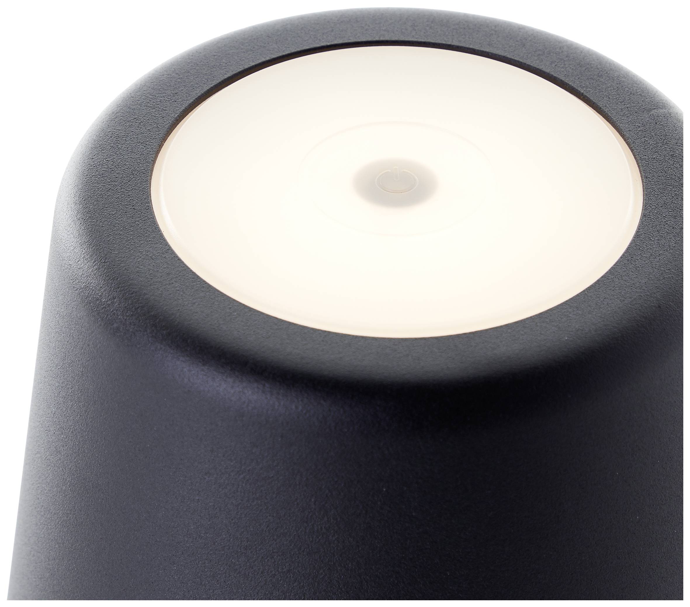 Bovenaanzicht van een zwarte cilindrische lamp met wit uitstralend licht in het midden.