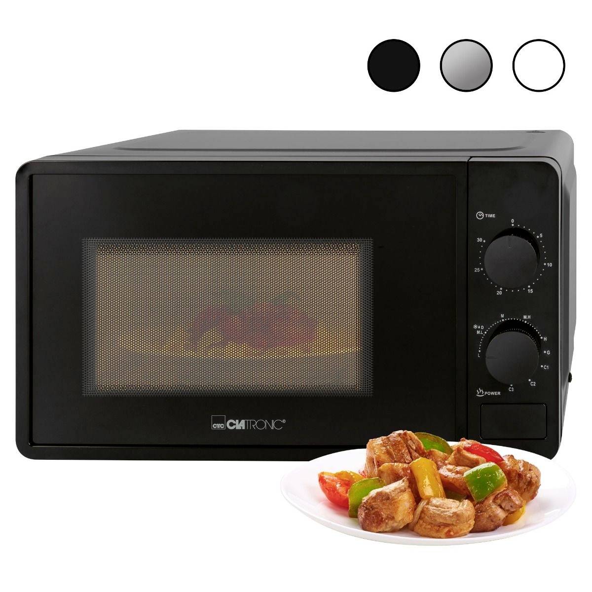 Zwarte magnetron met twee draaiknoppen, met gebakken groenten op een wit bord ervoor. Linksboven drie kleurstalen.