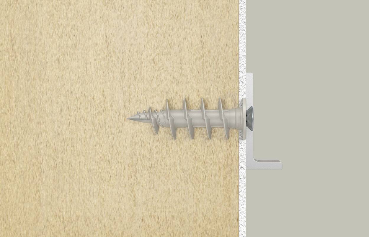 Een kunststof pluggen wordt in een houten wand bevestigd om een metalen hoeksteun houvast te geven. De hoeksteun is met een schroef aan de plug vastgemaakt.