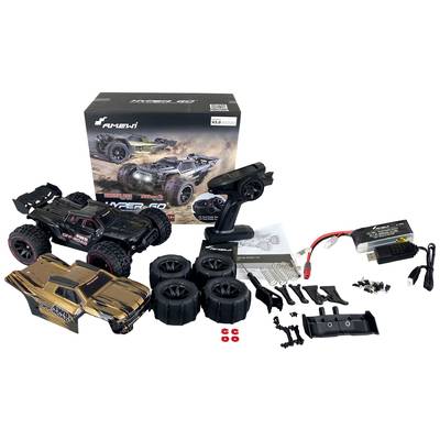 RC-modelautoset met een voertuig, reservebanden, een afstandsbediening, accessoireonderdelen, een oplader en de verpakking.