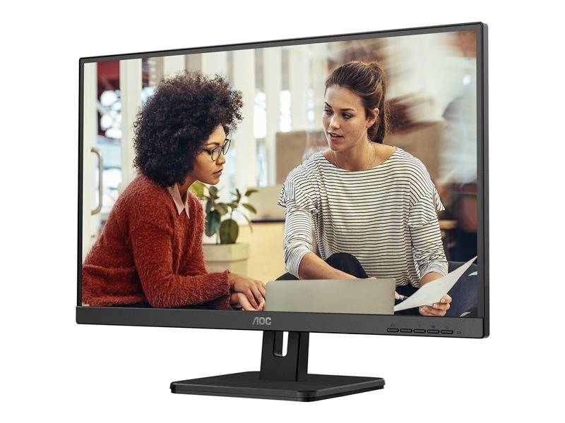 Twee personen zitten voor een monitor en discussiëren over een document. Eén persoon heeft krullend haar, de ander heeft een paardenstaart.