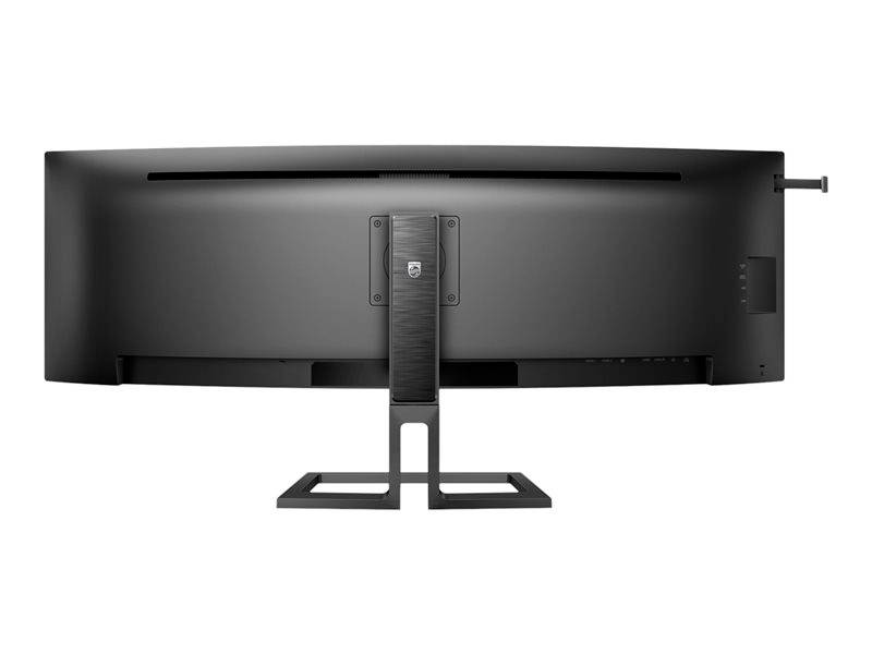 Een grote, brede computerscherm, zwart, bekeken van achteren op een rechthoekige standaard.