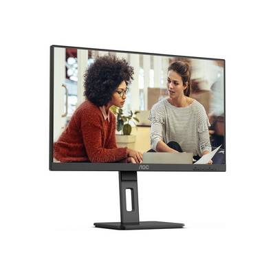 Twee personen zitten in een kantoor en praten geconcentreerd. Een monitor, planten en werkdocumenten zijn op de achtergrond.