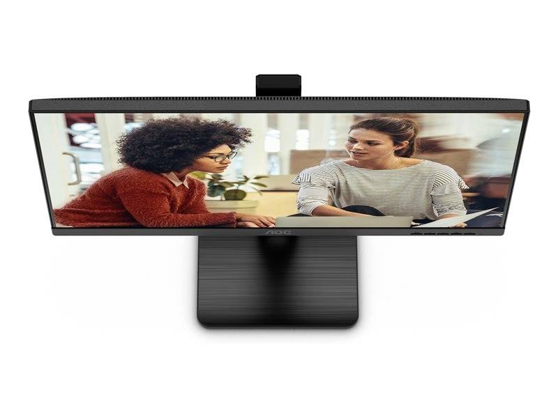 Twee personen zitten aan een tafel en voeren een gesprek. Eén persoon houdt papieren in de hand. Op de achtergrond zijn wazig details zichtbaar.