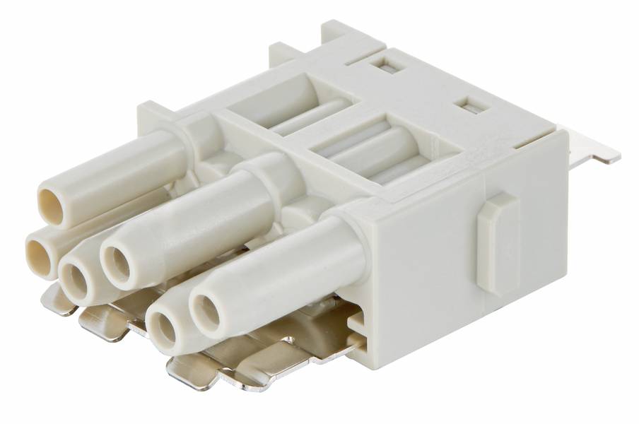 Kunststof stekker met vier buizen en metalen contacten, in een rechthoekige behuizing, voor elektrische verbindingen.