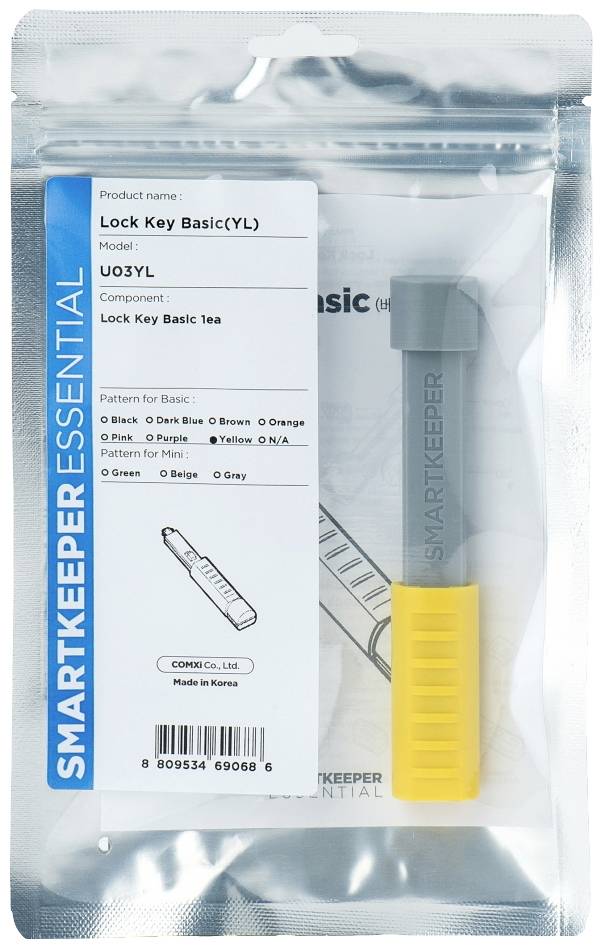 'SmartKeeper Essential Slot Sleutel Basis(YL)' Productverpakking met gele sleutelbeveiliging. Bevat details over model en componenten.