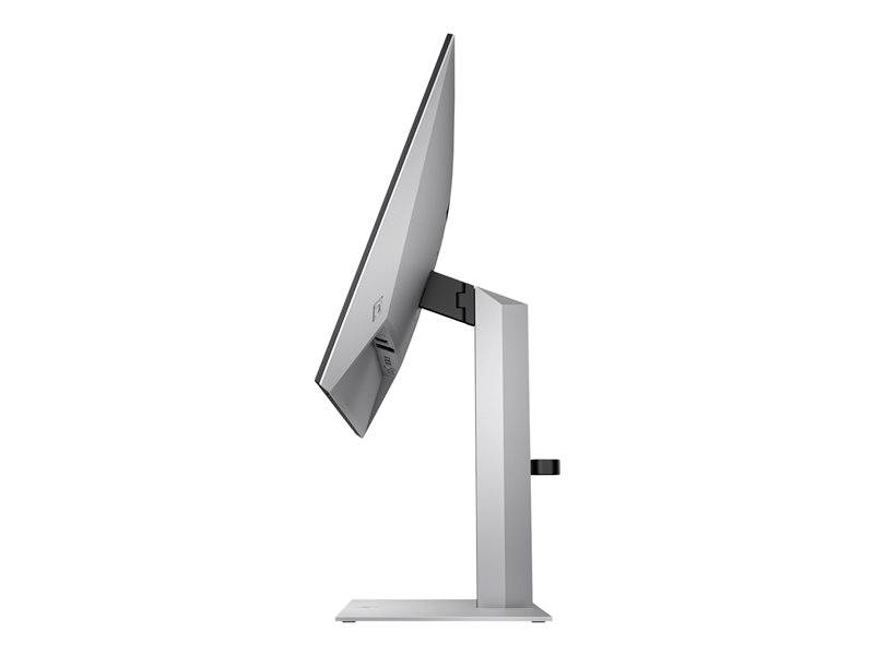 Een computermonitor gefotografeerd van opzij met een slanke vormgeving en een zilveren voet.