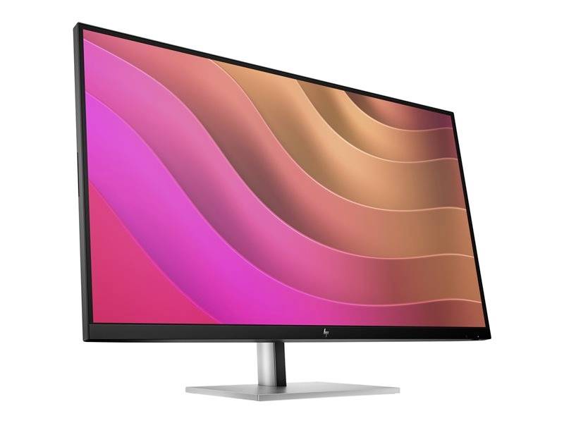 Een moderne computermonitor met een abstract, kleurrijk golfontwerp op het scherm.