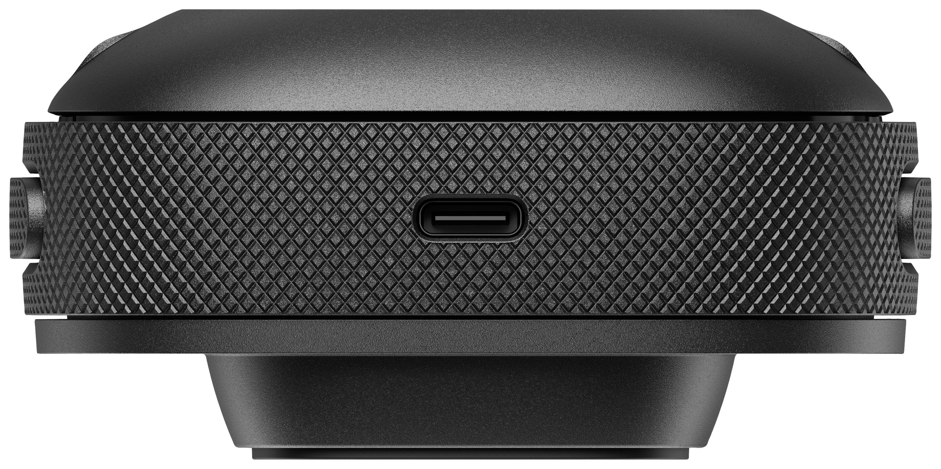 Een zwart, rond elektronisch apparaat met een USB-C-aansluiting en een getande textuur.