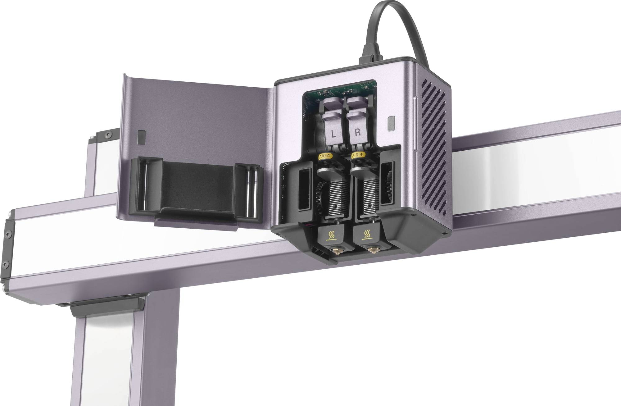 Een 3D-printkop is gemonteerd op een metalen frame. Twee spuitmonden zijn zichtbaar, gemarkeerd met 'L' en 'R'. Een kabel loopt omhoog.