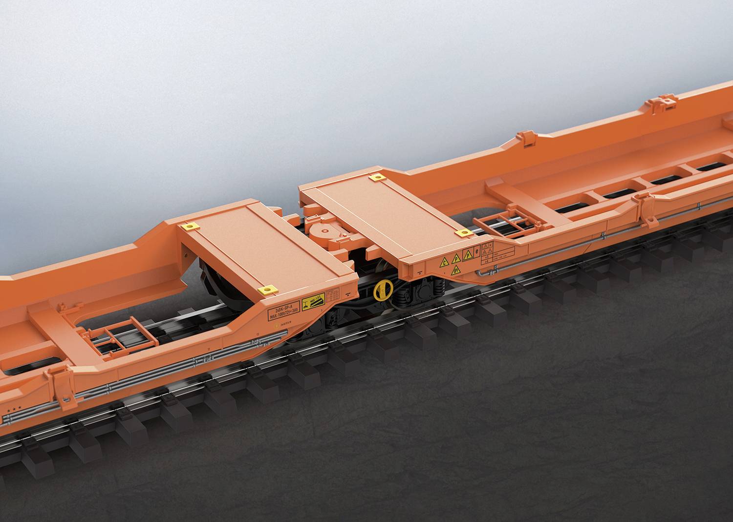 Een oranje spoorwagonframe dat laat zien hoe twee onderdelen met elkaar zijn verbonden via rails.