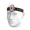 Witte borstbeeldje met hoofdlamp op een zwarte hoofdband waarop 'ARMYTEK' staat. De lamp brandt rood.