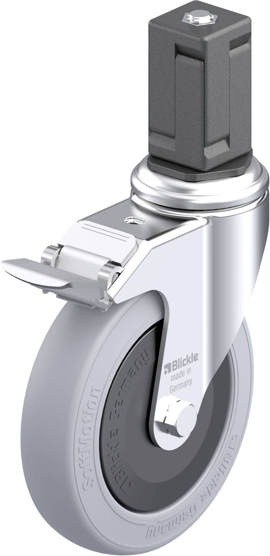 Grijs rolstoelwiel met metalen bevestiging en rem, merkenlogo en opschrift 'Blickle'. Geschikt voor montage aan meubels of apparaten.
