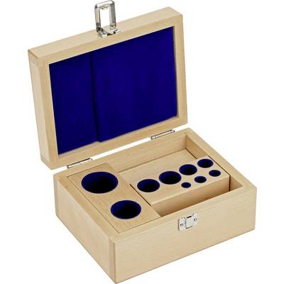 Houten kist met metalen slot, aan de binnenkant bekleed met blauw fluweel en voorzien van meerdere ronde uitsparingen van verschillende afmetingen.