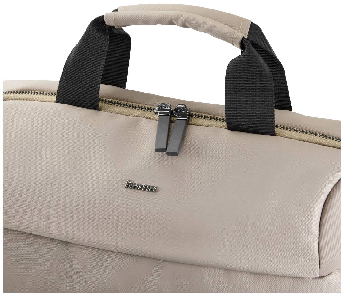 Beige tas met zwarte handvatten en rits, met het merk 'hama' zichtbaar aan de voorkant.