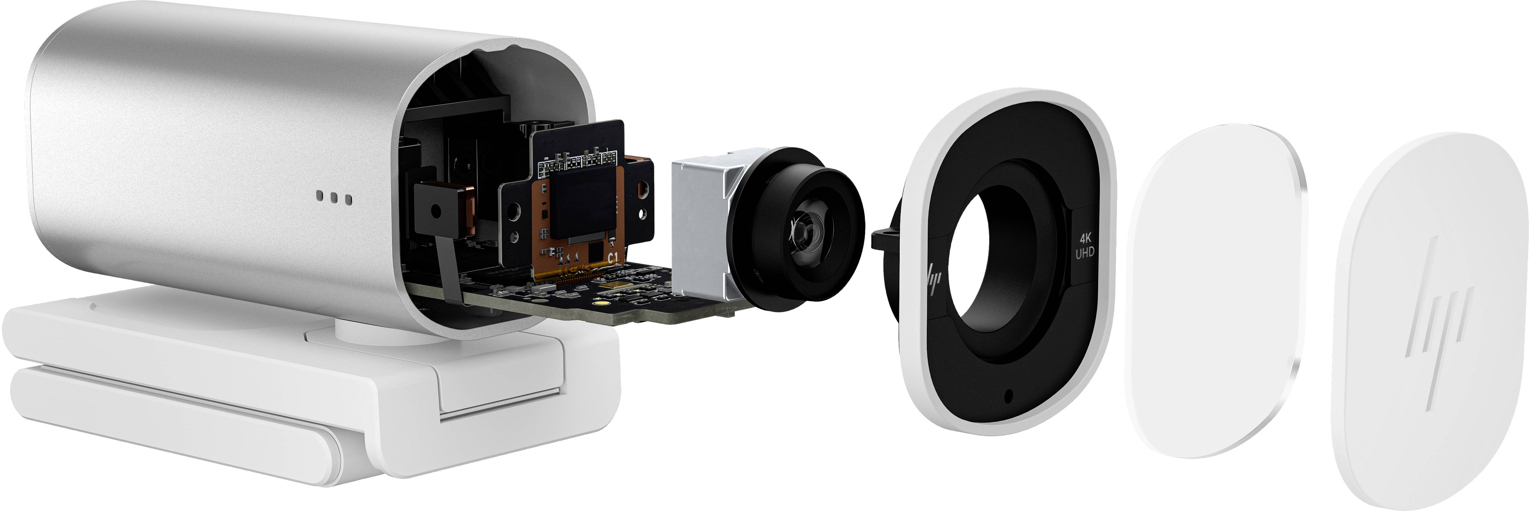 Ontploffingstekening van een kleine camera, waarbij de interne componenten zoals lens, sensor en printplaat worden getoond, samen met de behuizing.