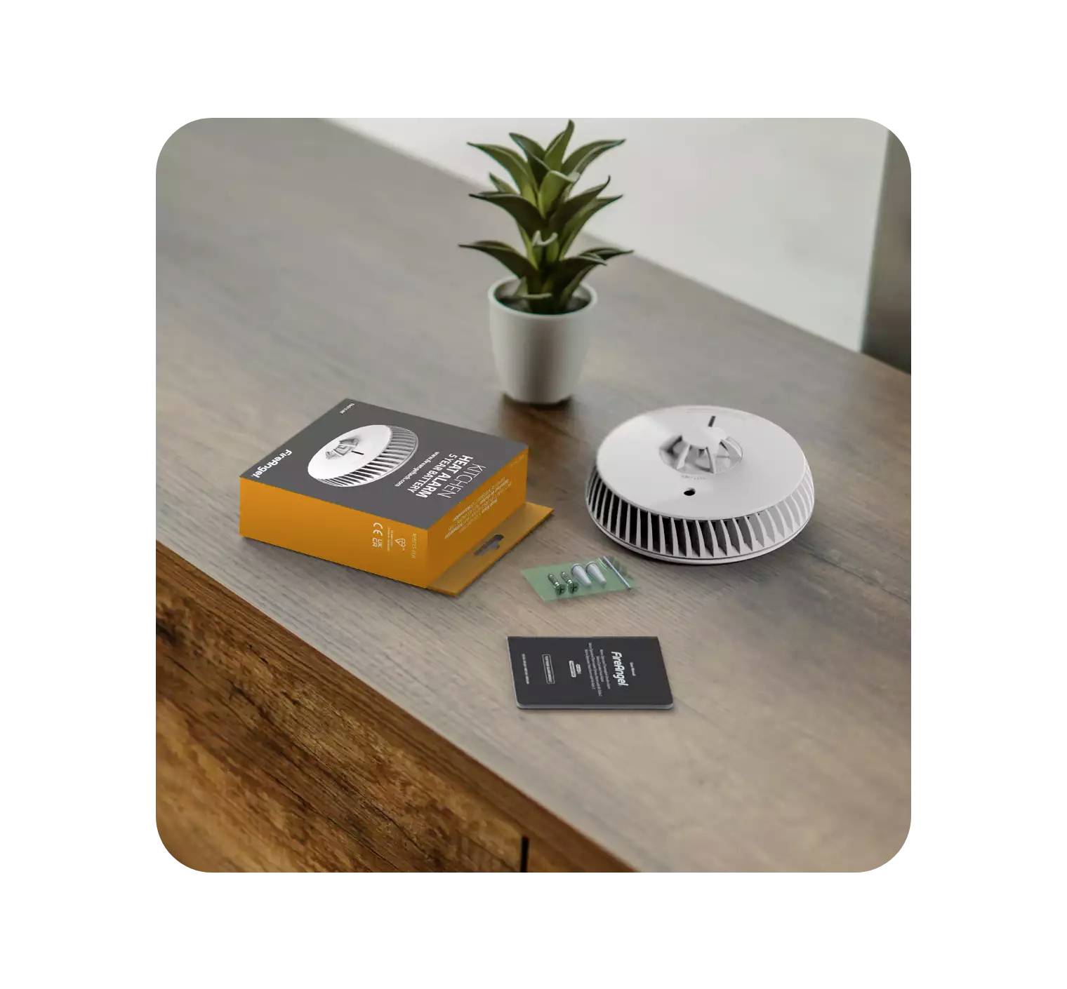 Een lamp met toebehoren en verpakking ligt op een houten tafel naast een kleine plant in een witte pot.